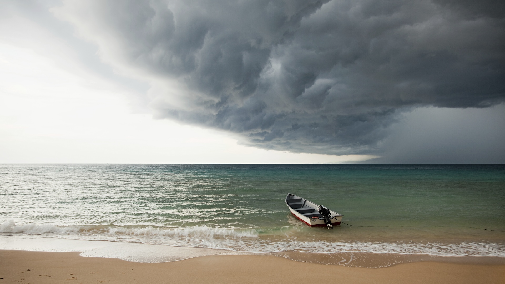 Boat on sea under stormy sky, Perhentian Kecil, Malaysia